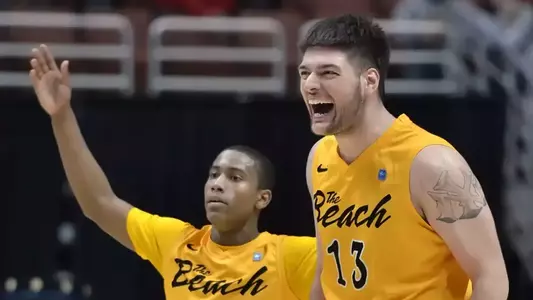 3/10/12 - Michael Caffey (5) and Edis Dervisevic (13) of the Long Beach State Basketball team celebrates near the end of the Big West Tournament Championship game against UCSB Saturday night at the Honda Center.
Photo by Steven Georges/LBSU
LBSU Photo Archive - www.StevenGeorges.com/LBSU