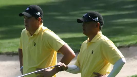 Big West Conference Men's Golfer of the Month Kevin Roy and 49er head coach Mickey Yokoi.