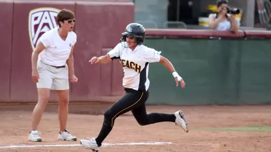 Cya Neal rounds third on her way to scoring the winning run against LIU.