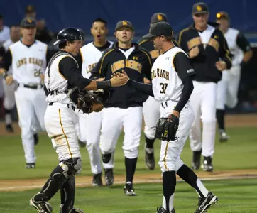 Kyle Friedrichs and Kellen Hoime celebrate the Dirtbags win as the team comes in.