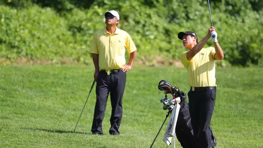 Phillip Chian (right) and head coach Mickey Yokoi at the 2012 NCAA Men's Golf Championship at Riviera Country Club in Pacific Palisades.  (Photo by Darryl Oumi/LBSU)