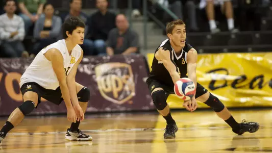Taylor Crabb keeps the ball live in the Mountain Pacific Sports Federation volleyball match against University of Hawaii at the Walter Pyramid, Long Beach, Calif., Fri., Jan. 18, 2013