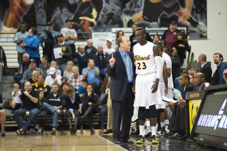 Coach Dan Monson with Deng Deng