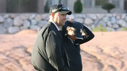 Head coach Joey Cerulle and senior Rochelle Chan were battling gusty 45 mph winds on Monday morning in Las Vegas.