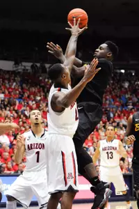 Nov 11, 2013; Tucson, AZ, USA; Long Beach State 49ers forward David Samuels (11) shoots the ball as he is defended by Arizona Wildcats forward Rondae Hollis-Jefferson (23) during the second half at McKale Center. Arizona beat Long Beach State 91-57. Mandatory Credit: Casey Sapio-USA TODAY Sports