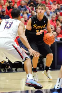 Nov 11, 2013; Tucson, AZ, USA; Long Beach State 49ers guard McKay LaSalle (31) prepares to pass as he is guarded by Arizona Wildcats guard Nick Johnson (13) during the second half at McKale Center. Arizona beat Long Beach State 91-57. Mandatory Credit: Casey Sapio-USA TODAY Sports