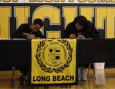 Justin Bibbins signs his NLI at Bishop Montgomery High School on Wednesday.