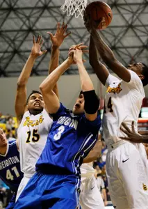 Dec 3, 2013; Long Beach, CA, USA; Long Beach State 49ers guard A.J. Spencer (15) and Creighton Bluejays forward Doug McDermott (3) and 49ers guard Branford Jones (14) fight for the rebound during the first half at Walter Pyramid. Mandatory Credit: Kelvin Kuo-USA TODAY Sports