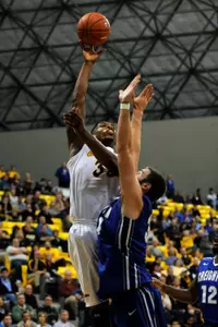 Dec 3, 2013; Long Beach, CA, USA; Long Beach State 49ers forward Dan Jennings (35) attempts a shot defended by  Creighton Bluejays forward Ethan Wragge (34) during the second half at Walter Pyramid. The Creighton Blue Jays defeated the Long Beach State 49ers 78-61. Mandatory Credit: Kelvin Kuo-USA TODAY Sports