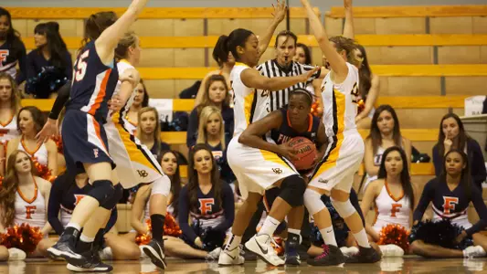 Jade Wilson and Lauren Spargo in the Big West Conference Tournament match against Cal State Fullerton at the Bren Events Center, Irvine, Calif., Tues., March 12, 2013.