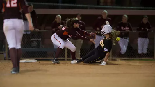 Nalani St. German sliding into third in the Long Beach State Invitational game against Virginia Tech at Mayfair Park, in Lakewood, Calif., Thurs., Mar. 07, 2013.
