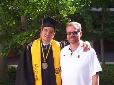 Basketball player Peter Pappageorge with academic counselor Chris Jolly