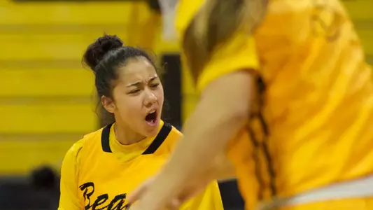 Hallie Meneses celebrates after making the game-tying 3-pointer with 0.2 seconds left in regulation. (Photo by John Fajardo)