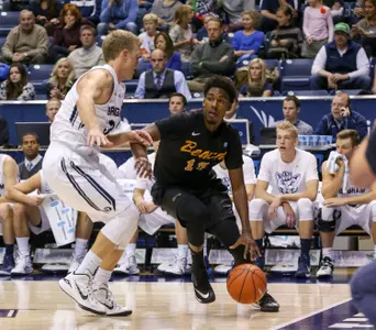 Nov 14, 2014; Provo, UT, USA; Long Beach State 49ers forward David Samuels (11) shoots the ball over Brigham Young Cougars forward Nate Austin (33) during the first half at Marriott Center. Mandatory Credit: Chris Nicoll-USA TODAY Sports