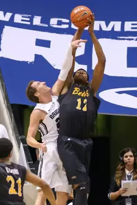 Nov 14, 2014; Provo, UT, USA; Long Beach State 49ers guard Branford Jones (14) shoots the ball over the out stretched arm of Brigham Young Cougars forward Nate Austin (33) during the first half at Marriott Center. Mandatory Credit: Chris Nicoll-USA TODAY Sports