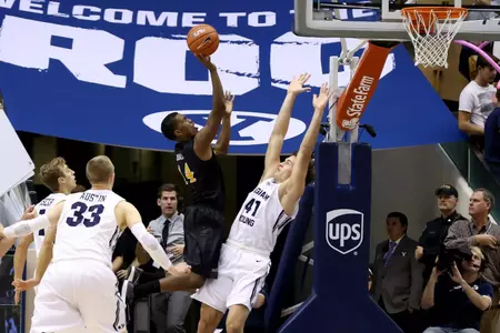 Nov 14, 2014; Provo, UT, USA; Brigham Young Cougars forward Nate Austin (33) goes to block a shot from Long Beach State 49ers forward David Samuels (11) during the second half at Marriott Center. Brigham Young Cougars won the game 95-90. Mandatory Credit: Chris Nicoll-USA TODAY Sports