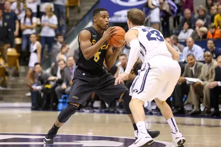 Nov 14, 2014; Provo, UT, USA; Long Beach State 49ers guard Mike Caffey (5) looks to pass the ball past Brigham Young Cougars guard Skyler Halford (23) during the first half at Marriott Center. Mandatory Credit: Chris Nicoll-USA TODAY Sports
