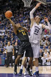 Nov 14, 2014; Provo, UT, USA; Long Beach State 49ers guard Mike Caffey (5) looks to pass the ball past Brigham Young Cougars guard Skyler Halford (23) during the first half at Marriott Center. Mandatory Credit: Chris Nicoll-USA TODAY Sports