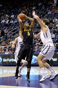 Nov 14, 2014; Provo, UT, USA; Long Beach State 49ers guard Mike Caffey (5) shoots over Brigham Young Cougars forward Luke Worthington (41) during the first half at Marriott Center. Brigham Young Cougars won the game 95-90. Mandatory Credit: Chris Nicoll-USA TODAY Sports