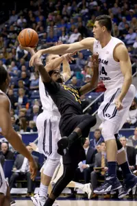 Nov 14, 2014; Provo, UT, USA; Long Beach State 49ers guard Mike Caffey (5) shoots over Brigham Young Cougars forward Luke Worthington (41) during the first half at Marriott Center. Brigham Young Cougars won the game 95-90. Mandatory Credit: Chris Nicoll-USA TODAY Sports