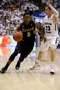 Nov 14, 2014; Provo, UT, USA; Long Beach State 49ers guard McKay LaSalle (31) shoots the ball while being guarded by Brigham Young Cougars guard Tyler Haws (3) during the first half at Marriott Center. Brigham Young Cougars won the game 95-90. Mandatory Credit: Chris Nicoll-USA TODAY Sports