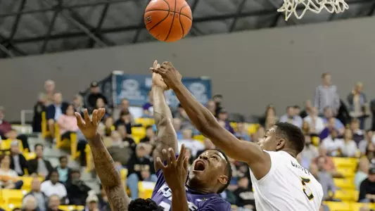 Mike Caffey blocks a shot by Kansas State Wildcats guard Marcus Foster. Kelvin Kuo-USA TODAY Sports