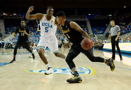 Nov 23, 2014; Los Angeles, CA, USA; Long Beach State 49ers guard Tyler Lamb (1) drives against UCLA Bruins forward Kevon Looney (5) during the first half at Pauley Pavilion. Mandatory Credit: Richard Mackson-USA TODAY Sports