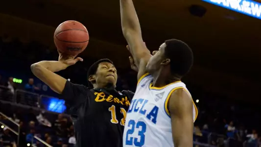 Nov 23, 2014; Los Angeles, CA, USA; Long Beach State 49ers forward Eric McKnight (12) shoots against UCLA Bruins forward Tony Parker (23) during the first half at Pauley Pavilion. Mandatory Credit: Richard Mackson-USA TODAY Sports