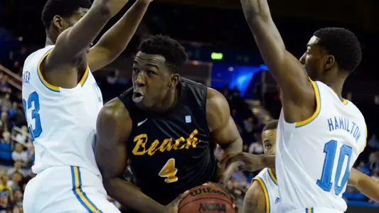 Nov 23, 2014; Los Angeles, CA, USA; Long Beach State 49ers forward Temidayo Yussuf (4) is defended by UCLA Bruins guard Isaac Hamilton (10) and forward Tony Parker (23) during the first half at Pauley Pavilion. Mandatory Credit: Richard Mackson-USA TODAY Sports
