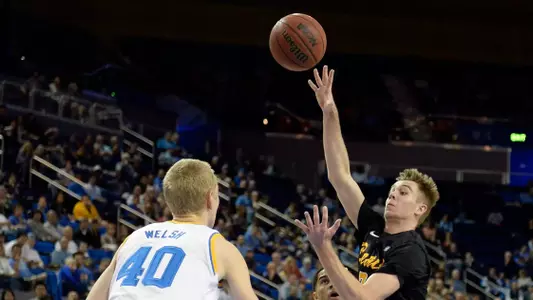 Nov 23, 2014; Los Angeles, CA, USA; Long Beach State 49ers forward Jack Williams (35) shoots against UCLA Bruins center Thomas Welsh (40) during the first half at Pauley Pavilion. Mandatory Credit: Richard Mackson-USA TODAY Sports