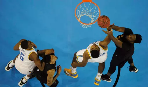 Nov 23, 2014; Los Angeles, CA, USA; UCLA Bruins forward Tony Parker (second from right) battles for a rebound with Long Beach State 49ers forward David Samuels (right) during the second half at Pauley Pavilion. Mandatory Credit: Richard Mackson-USA TODAY Sports