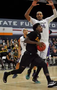 Long Beach State 49ers forward Temidayo Yussuf (4) moves the ball against Washington Huskies center Robert Upshaw (24) during the second half at Titan Gym. Mandatory Credit: Gary A. Vasquez-USA TODAY Sports