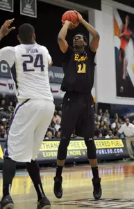 Long Beach State 49ers forward Eric McKnight (12) shoots against Washington Huskies during the second half at Titan Gym. Mandatory Credit: Gary A. Vasquez-USA TODAY Sports