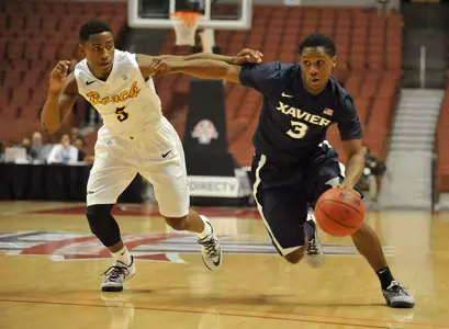 Xavier Musketeers guard Brandon Randolph (3) moves the ball against the defense of Long Beach State 49ers guard Mike Caffey (5) during the first half at Honda Center. Mandatory Credit: Gary Vasquez-USA TODAY Sports