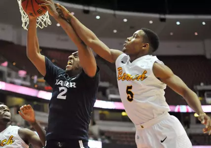 Xavier Musketeers forward James Farr (2) grabs a rebound against the defense of Long Beach State 49ers guard Mike Caffey (5) during the first half at Honda Center. Mandatory Credit: Gary Vasquez-USA TODAY Sports