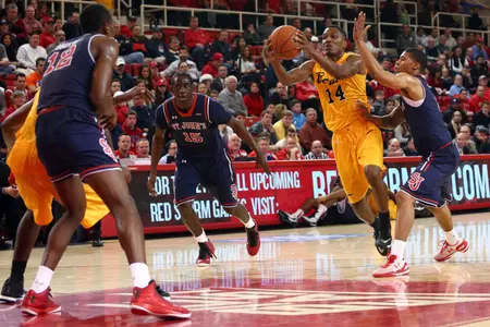 Branford Jones controls the ball against St. John's Red Storm guard Sir'Dominic Pointer. Brad Penner-USA TODAY Sports