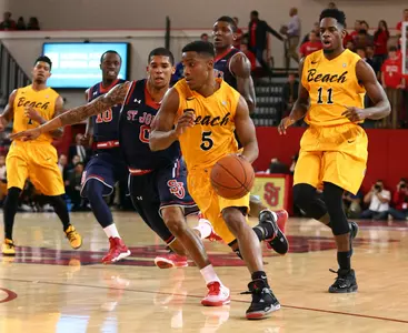 Mike Caffey controls the ball against St. John's Red Storm guard Jamal Branch. Brad Penner-USA TODAY Sports