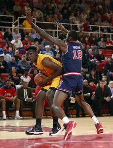 Temidayo Yussuf controls the ball against St. John's Red Storm forward Chris Obekpa. Brad Penner-USA TODAY Sports