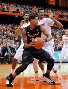 Dec 28, 2014; Syracuse, NY, USA; Long Beach State 49ers guard/forward Travis Hammonds (24) looks to put up a shot with Syracuse Orange forward Chris McCullough (5) defending during the first half of a game at the Carrier Dome. Mandatory Credit: Mark Konezny-USA TODAY Sports