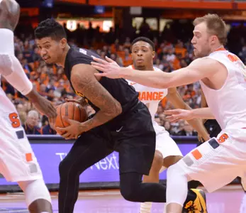 Dec 28, 2014; Syracuse, NY, USA; Long Beach State 49ers guard Tyler Lamb (1) drives the ball past Syracuse Orange defenders during the first half of a game at the Carrier Dome. Syracuse won the game 85-67. Mandatory Credit: Mark Konezny-USA TODAY Sports