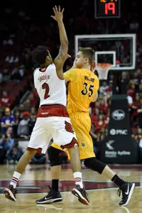 Dec 30, 2014; Louisville, KY, USA; Long Beach State 49ers forward Jack Williams (35) looks to pass under the pressure of Louisville Cardinals guard Quentin Snider (2) during the first half at KFC Yum! Center. Mandatory Credit: Jamie Rhodes-USA TODAY Sports