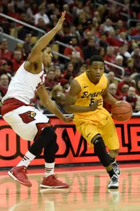 Dec 30, 2014; Louisville, KY, USA; Long Beach State 49ers guard Mike Caffey (5) dribbles against Louisville Cardinals guard/forward Wayne Blackshear (25) during the first half at KFC Yum! Center. Mandatory Credit: Jamie Rhodes-USA TODAY Sports