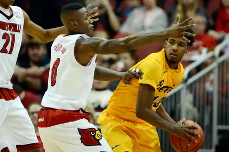 Dec 30, 2014; Louisville, KY, USA; Louisville Cardinals guard Terry Rozier (0) pressures Long Beach State 49ers guard Deontae North (13) during the second half at KFC Yum! Center. Louisvile defeated Long Beach State 63-48.  Mandatory Credit: Jamie Rhodes-USA TODAY Sports