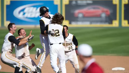Pongs (32) celebrates the win with his teammates.