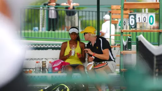 Jenny Hilt Costello talks to Maeva Razakasoa during the LBSU vs. UCI match at the 2014 Big West Tournament title.