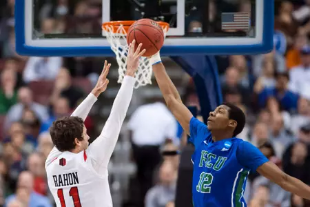 Mar 24, 2013; Philadelphia, PA, USA; Florida Gulf Coast Eagles forward Eric McKnight (12) defends the shot of San Diego State Aztecs guard James Rahon (11) during the first half during the third round of the NCAA basketball tournament at Wells Fargo Center. Mandatory Credit: Howard Smith-USA TODAY Sports