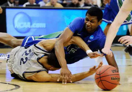 Mar 22, 2013; Philadelphia, PA, USA; Georgetown Hoyas forward Otto Porter Jr. (22) and Florida Gulf Coast Eagles forward Eric McKnight (12) scramble for possession of the ball during the first half in the second round of the 2013 NCAA tournament at the Wells Fargo Center. Mandatory Credit: Eileen Blass-USA TODAY Sports