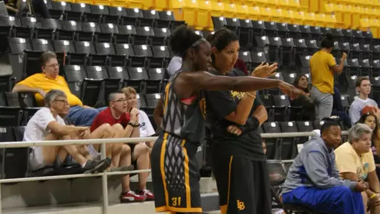 Senior Chantel Dooley and head coach Jody Wynn during the 49ers' first official team practice on Sunday