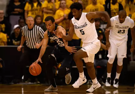Nov 16, 2015; Long Beach, CA, USA; Brigham Young Cougars guard Jordan Chatman (left) moves the ball defended by Long Beach State 49ers forward Temidayo Yussuf (right) during the first half at The Pyramid. Mandatory Credit: Kelvin Kuo-USA TODAY Sports