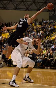 Nov 16, 2015; Long Beach, CA, USA; Brigham Young Cougars forward Kyle Davis (top) attempts to grab a ball on top of Long Beach State 49ers forward Gabe Levin (bottom) during the second half at The Pyramid. The Long Beach State 49ers won 66-65. Mandatory Credit: Kelvin Kuo-USA TODAY Sports